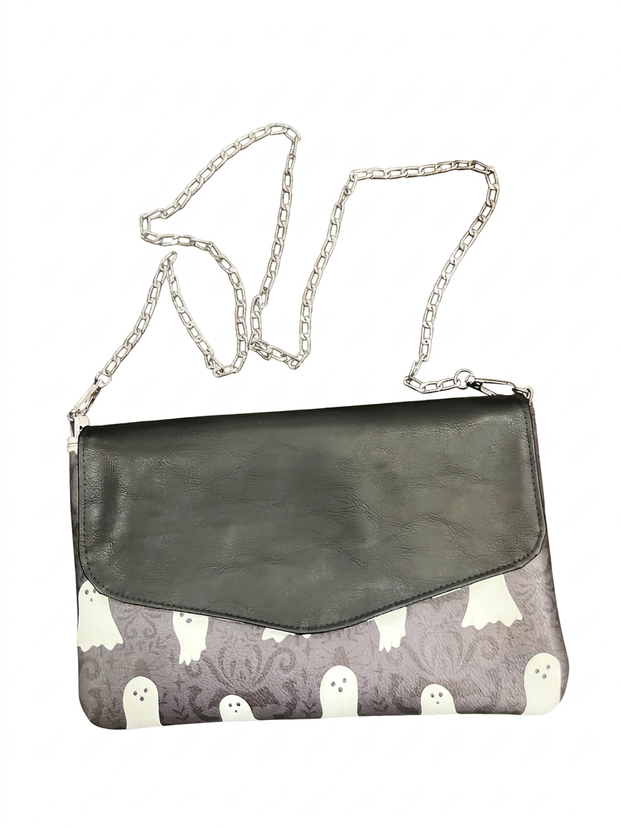 Boo After Dark envelope bag with white ghosts on a gray-purple body, black flap, and metal chain strap on white.